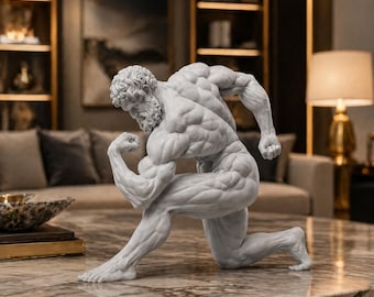 May include: A white marble sculpture of a muscular male figure in a dynamic pose, kneeling with one leg and flexing a bicep. The statue has detailed musculature and a beard. The sculpture is on a marble table.