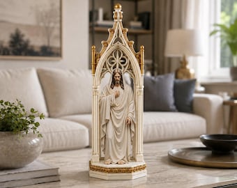 May include: A tall, off-white and gold-toned resin sculpture depicting a figure with long hair and a beard, wearing flowing robes. The figure stands within an intricate, pointed gothic-style archway featuring detailed carvings and a hexagonal base.
