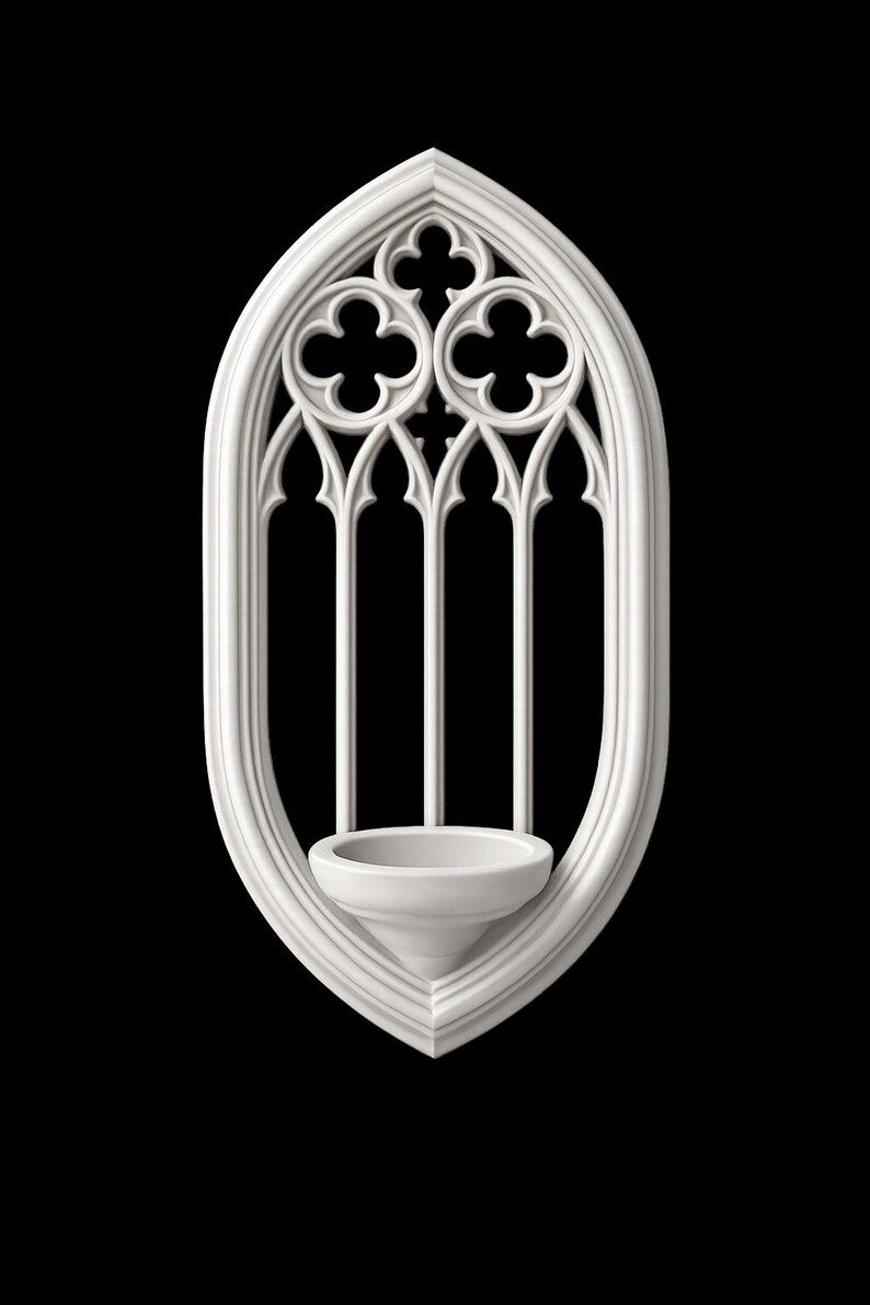 May include: A white, gothic-style wall sconce with an arched top and a small, bowl-shaped holder. The design features a quatrefoil pattern at the top and vertical bars, all against a black background. The sconce is approximately 10 inches tall.