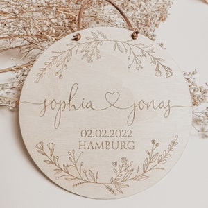 Personalized wooden wedding gift with name as a sign with hanging gift for the wedding