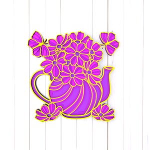 May include: A layered paper art piece featuring a purple teapot overflowing with pink flowers. Yellow outlines and accents highlight the design, with additional flowers and butterflies. The artwork is set against a white wooden background.
