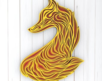 May include: A yellow and orange layered paper cut out of a fox in a curled up position.