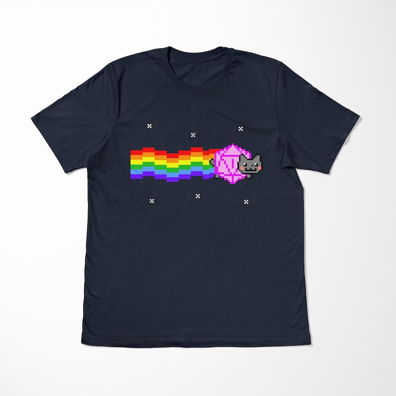 May include: A navy blue t-shirt with a pixelated image of a cat riding a rainbow. The cat is pink and gray and has a surprised expression.
