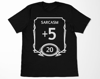 May include: Black t-shirt with a white graphic of a D&D style character sheet with the text "SARCASM +5 20".