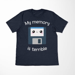 May include: A navy blue t-shirt with a white graphic of a floppy disk with a cute face and the text "My memory is terrible".