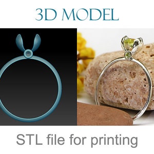 May include: A silver ring with a round band and a floral-shaped setting holding a green gemstone. The image also shows a 3D model of the ring and the text "STL file for printing".