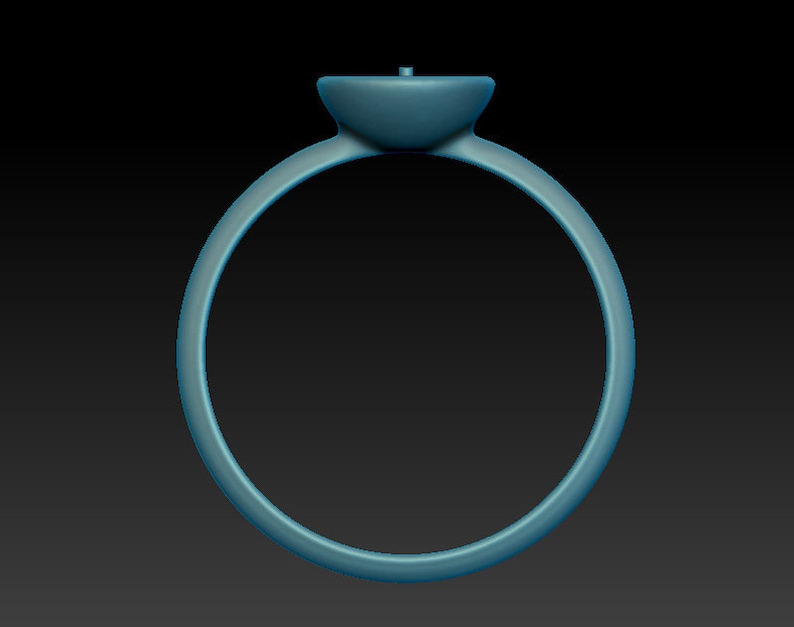 May include: A simple silver ring with a round, flat top. The ring is smooth and has a polished finish.