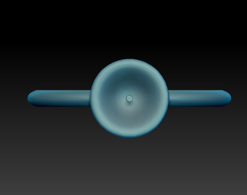 May include: A blue ceramic whistle with a round, slightly concave top and a small hole in the center.