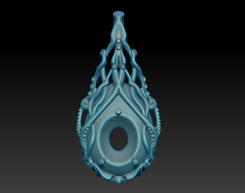 May include: A teal blue pendant with a detailed, intricate design resembling a stylized tree or plant. The pendant has a circular opening in the center and a loop at the top for hanging.