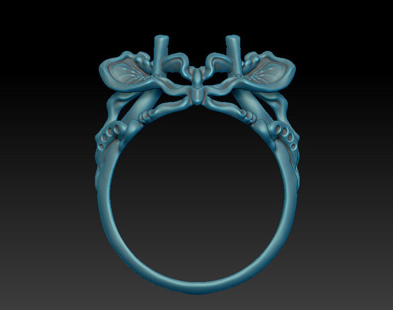 May include: A silver ring with a butterfly design. The butterfly's wings are detailed and intricate, and the ring is a delicate piece of jewelry.