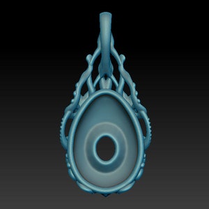 May include: A blue pendant with a detailed design resembling an octopus or sea creature. The pendant has a large oval-shaped opening in the center.