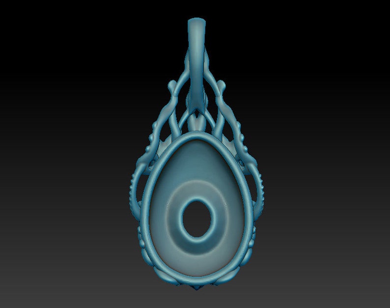 May include: A blue pendant with a detailed design resembling an octopus or sea creature. The pendant has a large oval-shaped opening in the center.