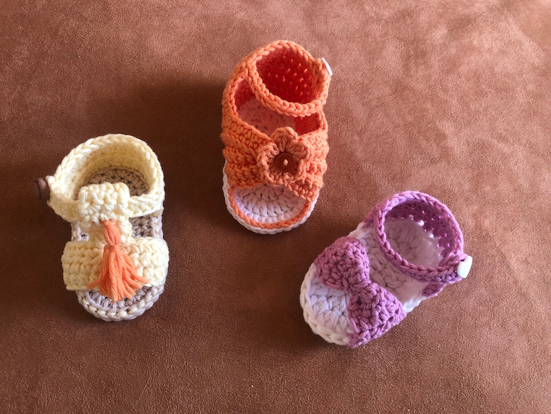 Super cute baby sandals in different designs. In orange, crocheted with flower or in pink with heart button made of cool soft cotton. image 7