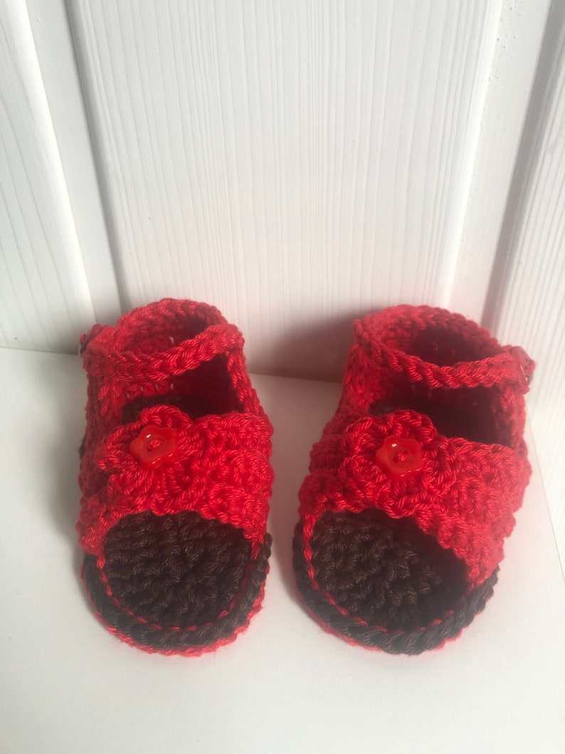 Super cute baby sandals in different designs. In orange, crocheted with flower or in pink with heart button made of cool soft cotton. image 10