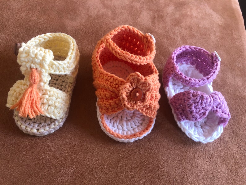 Super cute baby sandals in different designs. In orange, crocheted with flower or in pink with heart button made of cool soft cotton. image 6