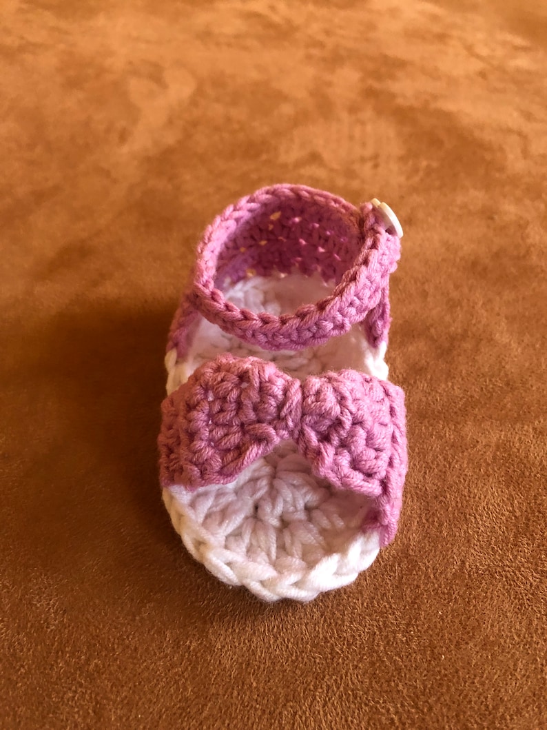 Super cute baby sandals in different designs. In orange, crocheted with flower or in pink with heart button made of cool soft cotton. image 4