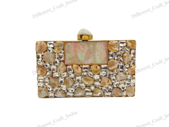Buy White Resin And Stone Embellishments Semi-circular Clutch Bag by Nayaab  by Aleezeh Online at Aza Fashions.