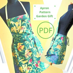 May include: A PDF pattern for a green apron with a floral print of yellow lilies. The apron has a tie at the waist and two pockets. The text "Apron Pattern Garden Gift" and "PDF" are visible in the image.