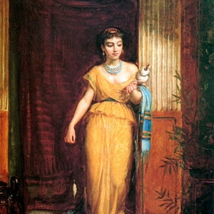 May include: A woman in a yellow gown and blue shawl stands in a doorway, holding a white bird. She wears a jeweled necklace and a headband. The background is a dark brown wall with a glimpse of a patterned rug.