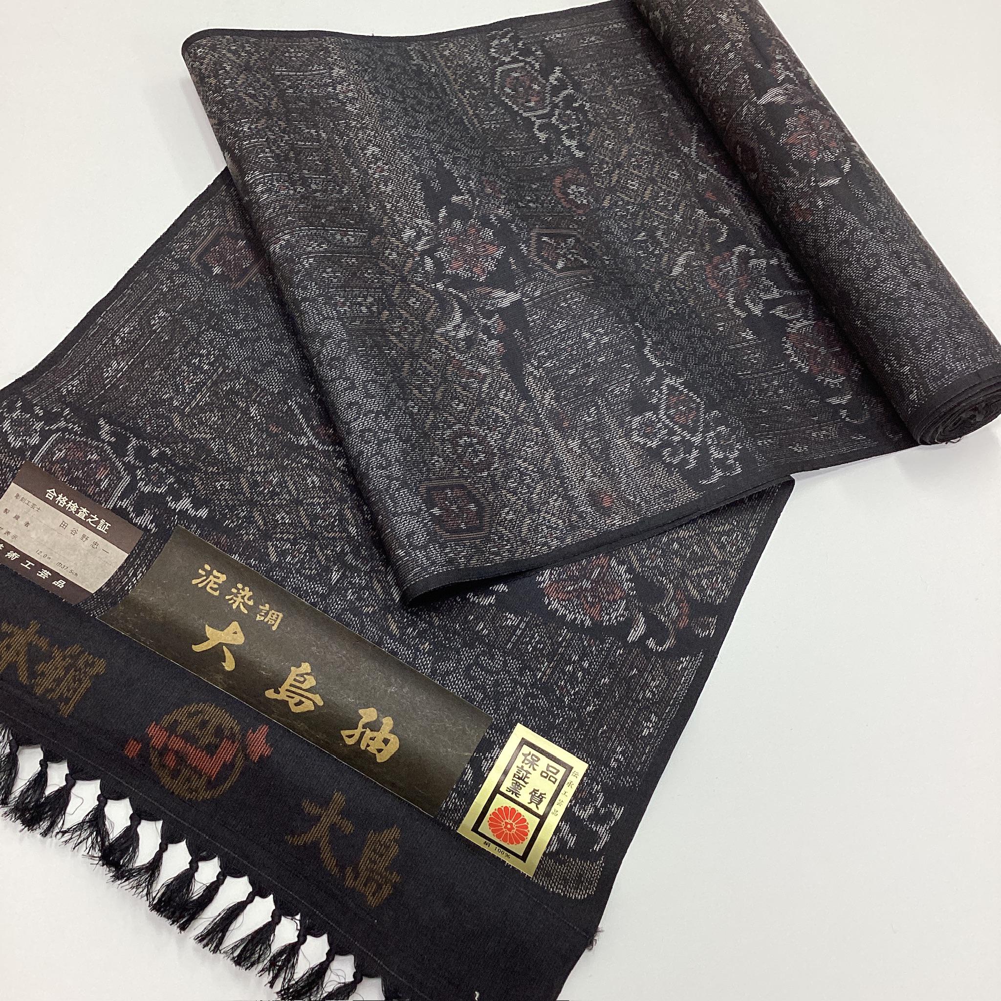 G919 未使用 正絹着物反物 12m 大島紬 黒地 / 絣による様々な花模様や
