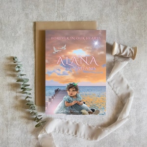 May include: A memorial card with a sunset sky background, a photo of a young girl in a blue dress, and the text "FOREVER IN OUR HEARTS ALANA 09.40 23 1 12.04 23 ADAMS"
