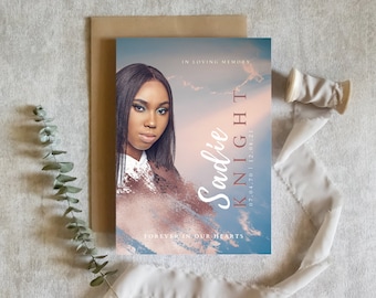 May include: A blue and pink memorial card with a photo of a woman. The text reads "In loving memory, Sadie Knight 07.04.70 - 12.08.21, Forever in our hearts."