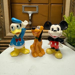 Vintage Disney ceramic figurine lot, Donald, Pluto, Mickey figurines.