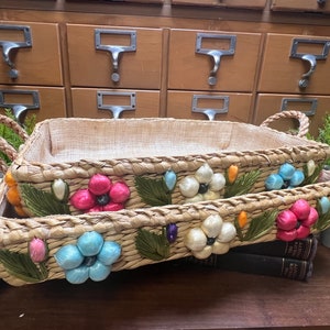 Vintage woven floral rafia baskets, set of 2 with floral decorations.