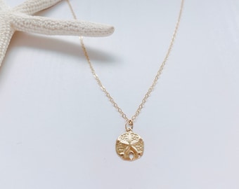 Halsband med guldfärgad sanddollar Halsband med sjöstjärna Elegant guldfärgad halsband Strandsmycken Hänge med guldfärgad sjöstjärna Sanddollar-berlock