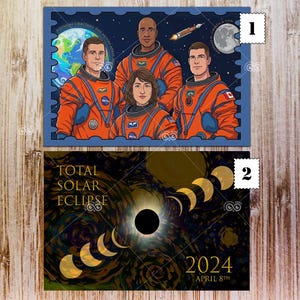 May include: Two postcards. The top one features a blue postage stamp design with four astronauts in orange suits, the Earth, a rocket, and the moon. The bottom postcard shows a total solar eclipse with the text "TOTAL SOLAR ECLIPSE 2024 APRIL 8th".
