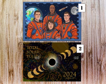 May include: Two postcards. The top one features a blue postage stamp design with four astronauts in orange suits, the Earth, a rocket, and the moon. The bottom postcard shows a total solar eclipse with the text "TOTAL SOLAR ECLIPSE 2024 APRIL 8th".