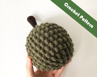 May include: A crocheted durian fruit with a brown stem. The durian is green and has a textured surface.