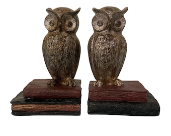 Vintage Owl Bookends On A Book Stack