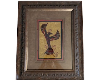 Cuadro con abalorios y diseño del ave fénix, obra de arte nativa americana de N.L. Buchanan.