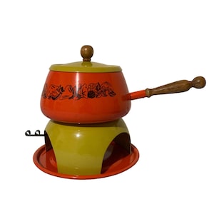 May include: A set of three ceramic nesting bowls in graduating sizes. The bowls are white with a speckled, textured finish and feature a slightly flared rim. Ideal for food prep or serving.