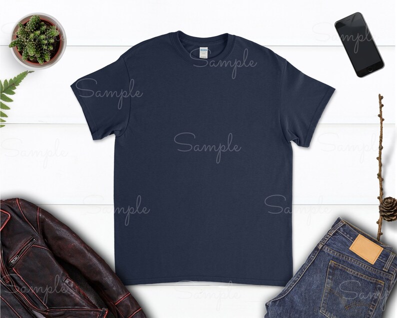 May include: A navy blue t-shirt with short sleeves and a crew neck.