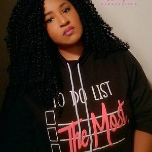 May include: Black hoodie with a white to-do list graphic and the words "The Most" in pink lettering.