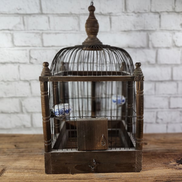 Antique/Vintage bird cage, with two small chinoiserie style bowls. Wood and metal wire with final.