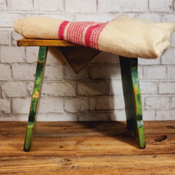 Antique primitive wood bench, milking milking stool, with its original green distressed paint, from Quebec, Canada