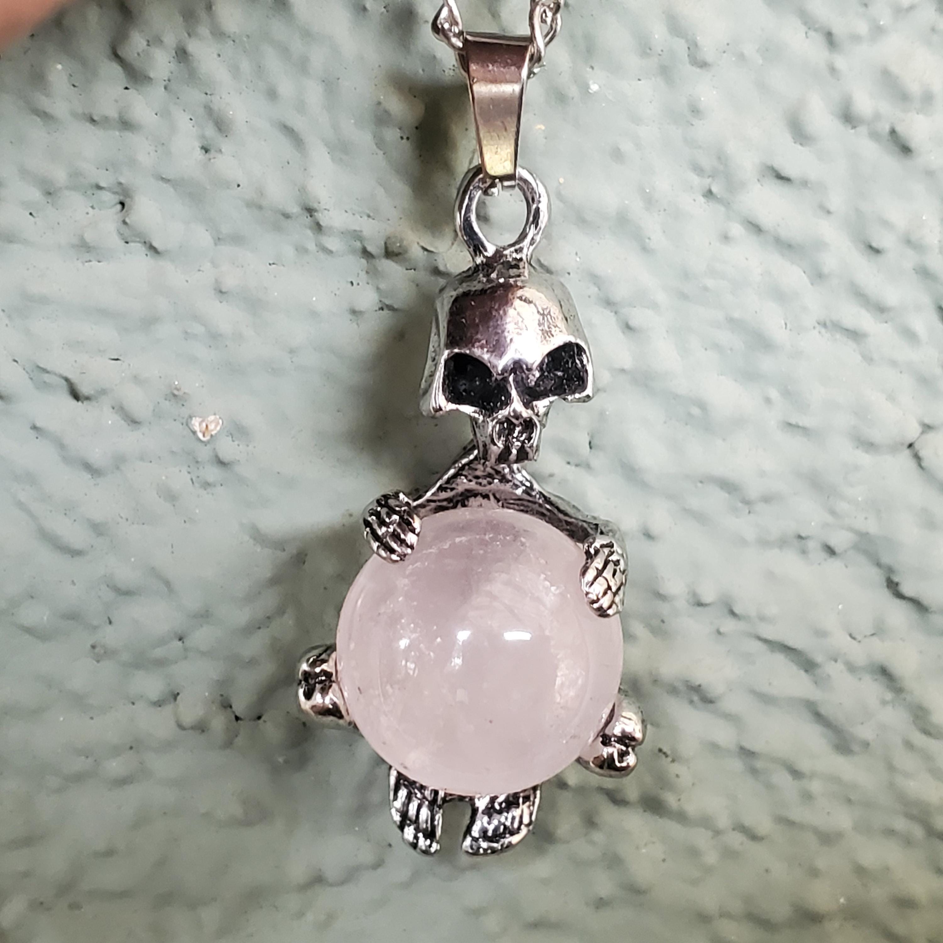 Alien Skull Skeleton Holding a Moveable Rose Quartz Ball Pendant