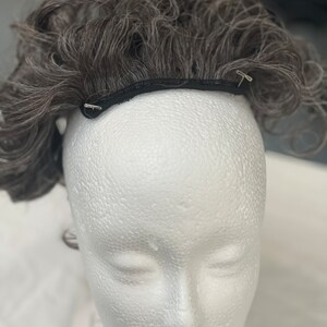 Ponytail in gray spiral curl
