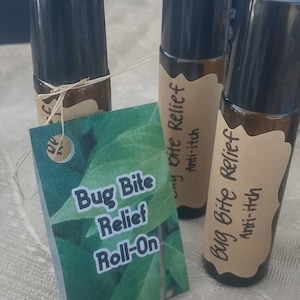 May include: Three brown glass roll-on bottles with labels that say "Bug Bite Relief Anti-itch". One bottle has a green leaf label that says "Bug Bite Relief Roll-On".