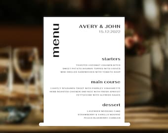 May include: A black and white menu with the names Avery & John and the date 15.12.2022. The menu lists starters, main course, and dessert options. The starters include toasted coconut chicken bites, sweet potato rounds topped with chives, and mini grilled sandwiches with tomato soup. The main course options are lightly seasoned trout with parsley vinaigrette, herb-roasted chicken and rice with fresh apricot, and fettuccine with Alfredo sauce. The dessert options are lavender wedding cake, strawberry & vanilla mousse, and peach blueberry cobbler.