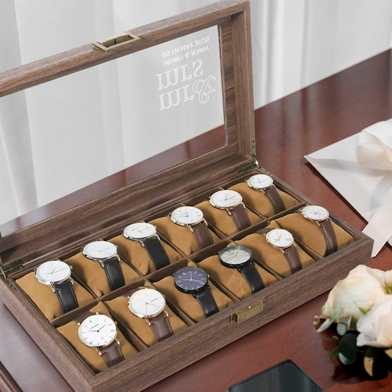 A handsome leather-wrapped wooden watch display case with custom engraving — the kind of thing that makes a watch collection feel like a museum.