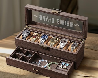 May include: A dark brown wooden watch box with a glass lid, containing six watches with different coloured faces and straps. The box has a lower drawer with compartments for jewellery. The text "DAVID SMITH" is etched on the inside of the lid.