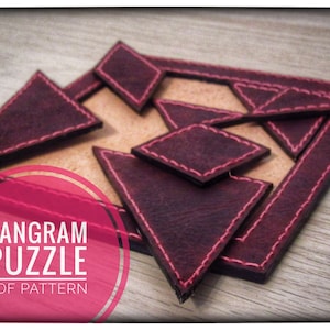 May include: A leather tangram puzzle with seven pieces in a burgundy colour. The pieces are arranged in a square shape with a tan background. The text "TANGRAM PUZZLE PDF PATTERN" is in a pink circle.