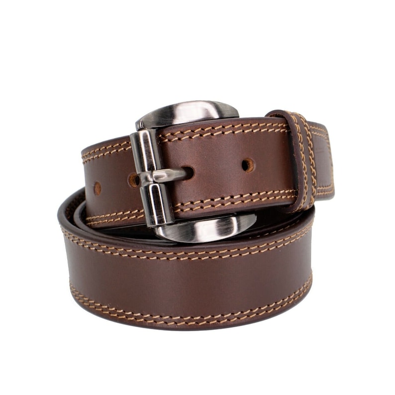 May include: A brown leather belt with a silver buckle and stitching. The belt is rolled up and the buckle is visible.