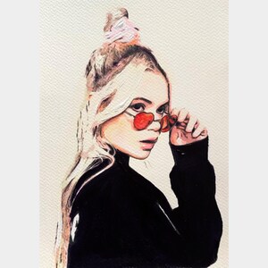 Original pop art portrait painting of a blonde woman wearing red sunglasses, created in a bold contemporary style with watercolor, acrylic, and marker on A4 acid-free Claire Fontaine paper. Strong lines and color blocks give this modern artwork a striking, graphic edge. Affordable, collectible, and ready to be framed behind glass.