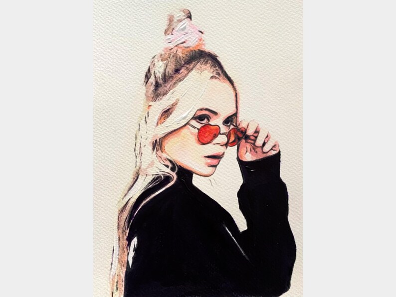 Original pop art portrait painting of a blonde woman wearing red sunglasses, created in a bold contemporary style with watercolor, acrylic, and marker on A4 acid-free Claire Fontaine paper. Strong lines and color blocks give this modern artwork a striking, graphic edge. Affordable, collectible, and ready to be framed behind glass.