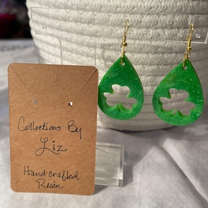 Handcrafted, Resin oval shaped with clover cut out drop Earrings. Green with glitter. St. Patrick’s Day?